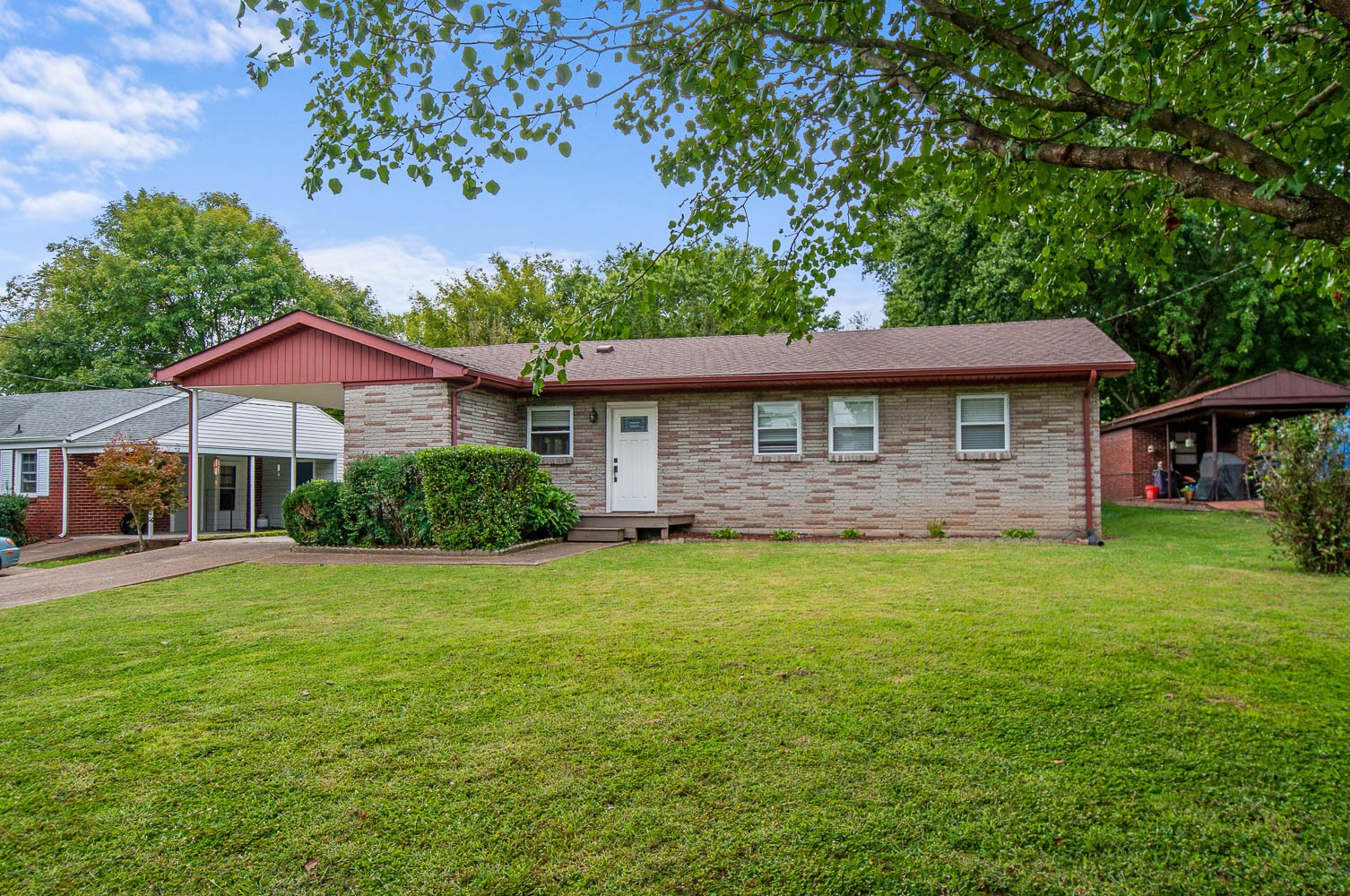 1014 Mitchell Road Nashville, TN 37206 - Photo 1 of 29 a front view of a house with a garden