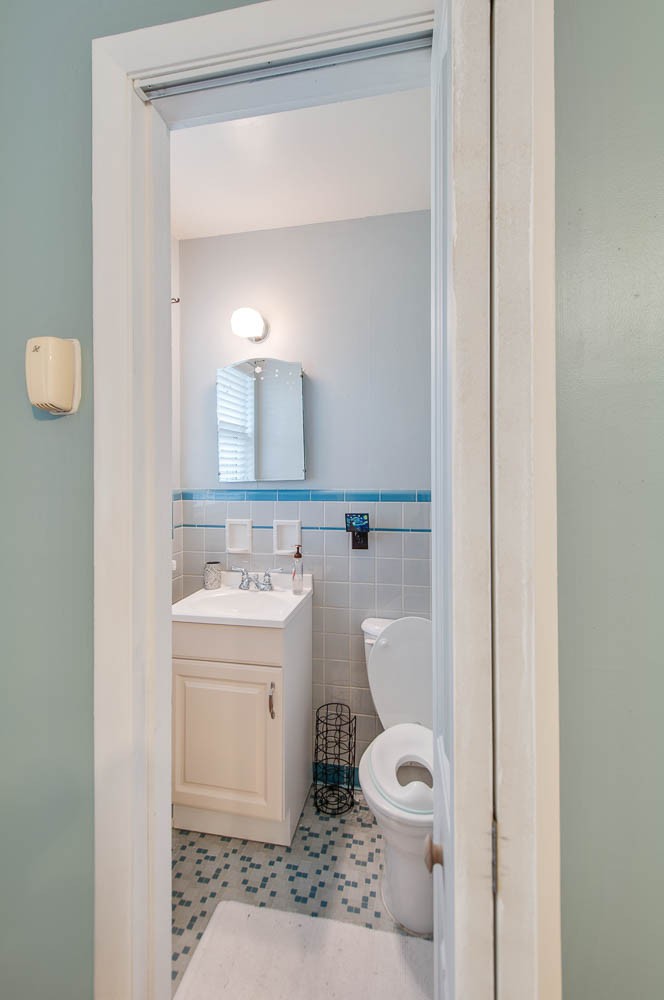 1014 Mitchell Road Nashville, TN 37206 - Photo 19 of 29 a bathroom with a toilet a sink and mirror