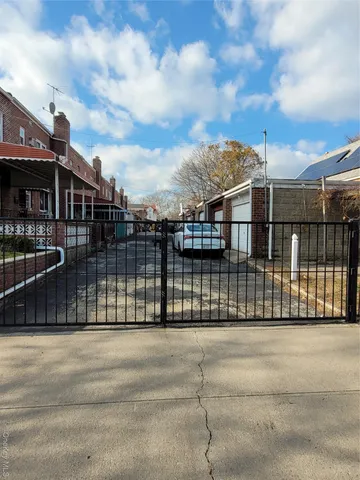 an empty room with wooden floor and a window