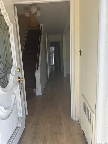 a view of a hallway with washer and dryer