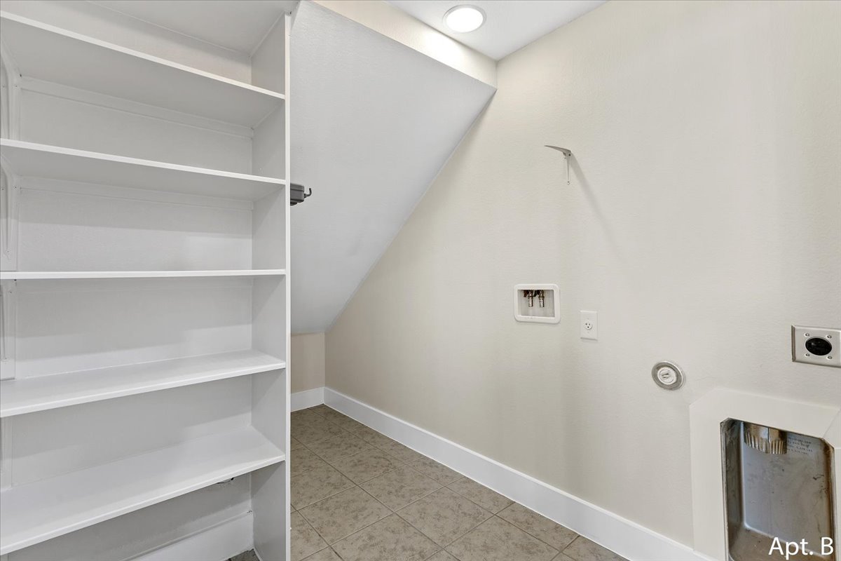 2225 Katy Lane, Unit B Georgetown, TX 78626 - Photo 22 of 22 Laundry room with light tile patterned floors, washer hookup, and hookup for an electric dryer
