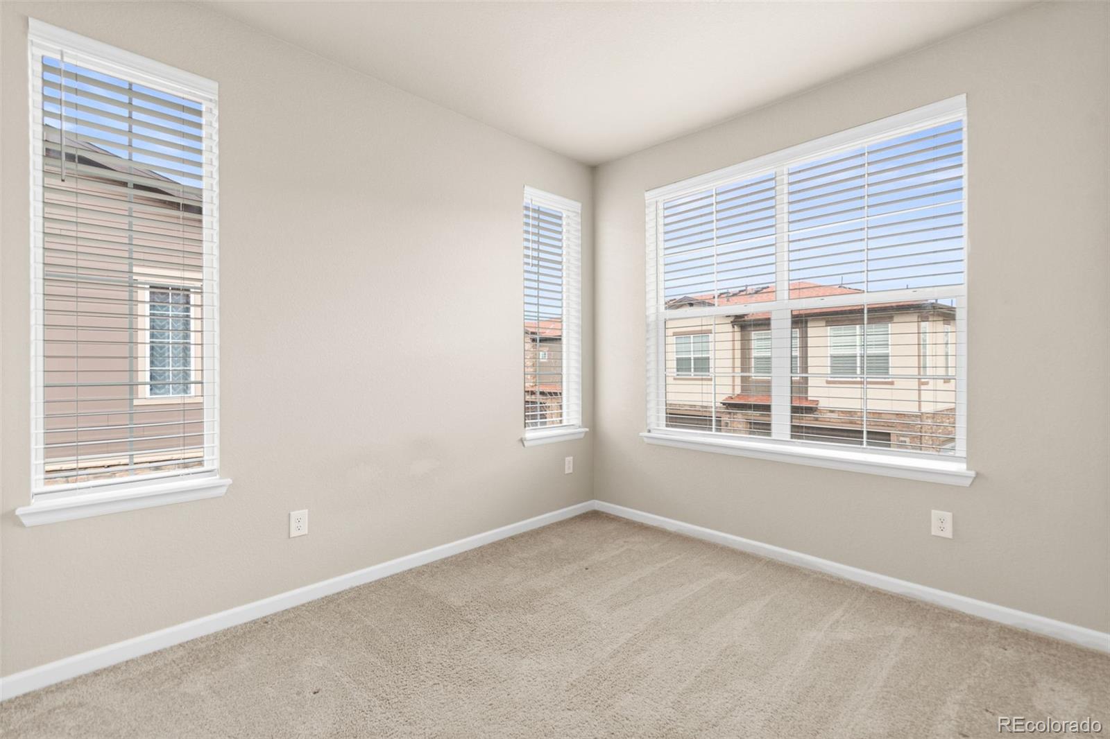 8417 Rizza Street, Unit A Littleton, CO 80129 - Photo 12 of 30 a view of an empty room with a window