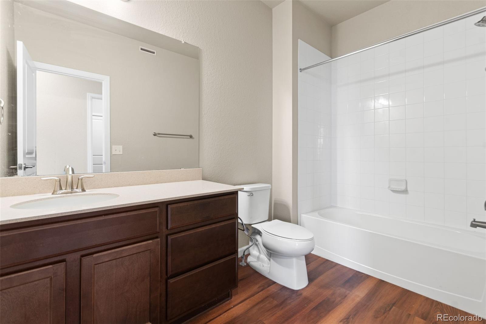 8417 Rizza Street, Unit A Littleton, CO 80129 - Photo 14 of 30 a bathroom with a sink and a mirror