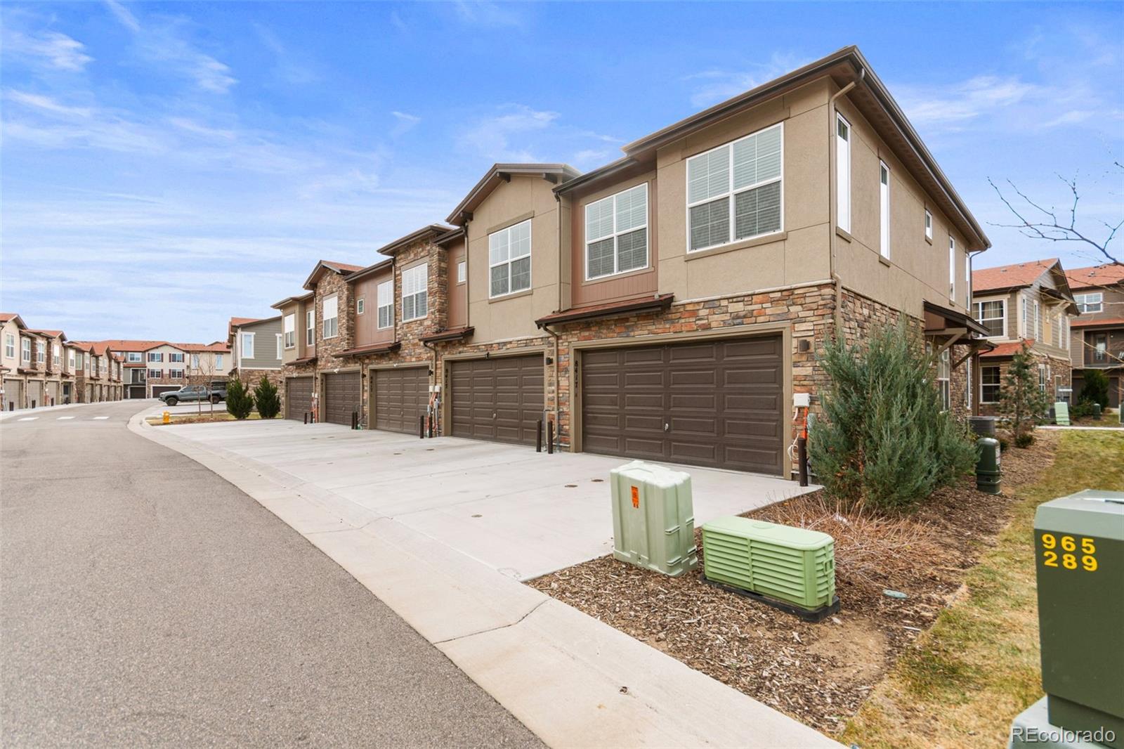 8417 Rizza Street, Unit A Littleton, CO 80129 - Photo 2 of 30 a front view of a house with a yard