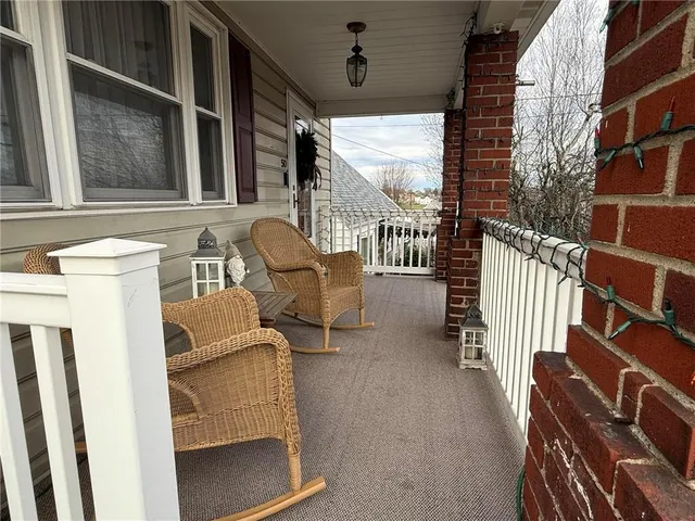 a view of a patio with a table and chairs