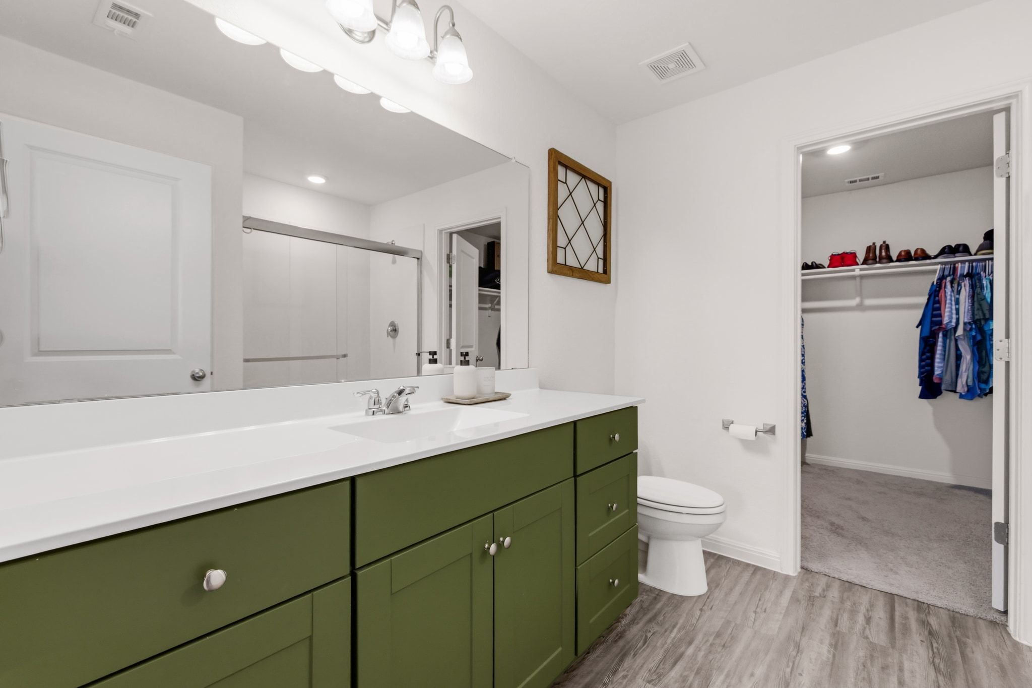 212 Wonderful Life Way Jarrell, TX 76537 - Photo 14 of 24 a bathroom with a toilet sink and mirror