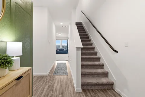 a view of entryway with wooden floor