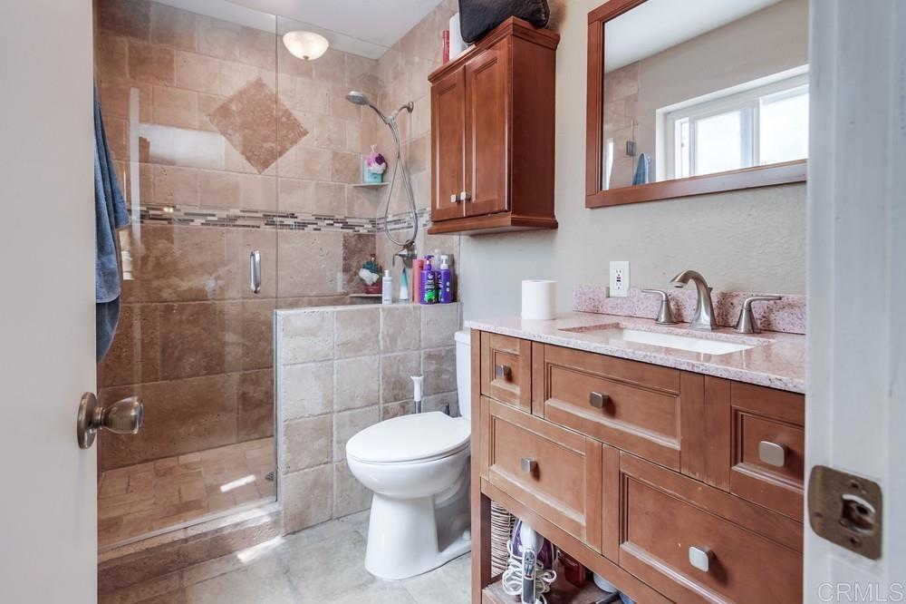 415 3rd Street Ramona, CA 92065 - Photo 17 of 33 a bathroom with a sink a toilet and shower