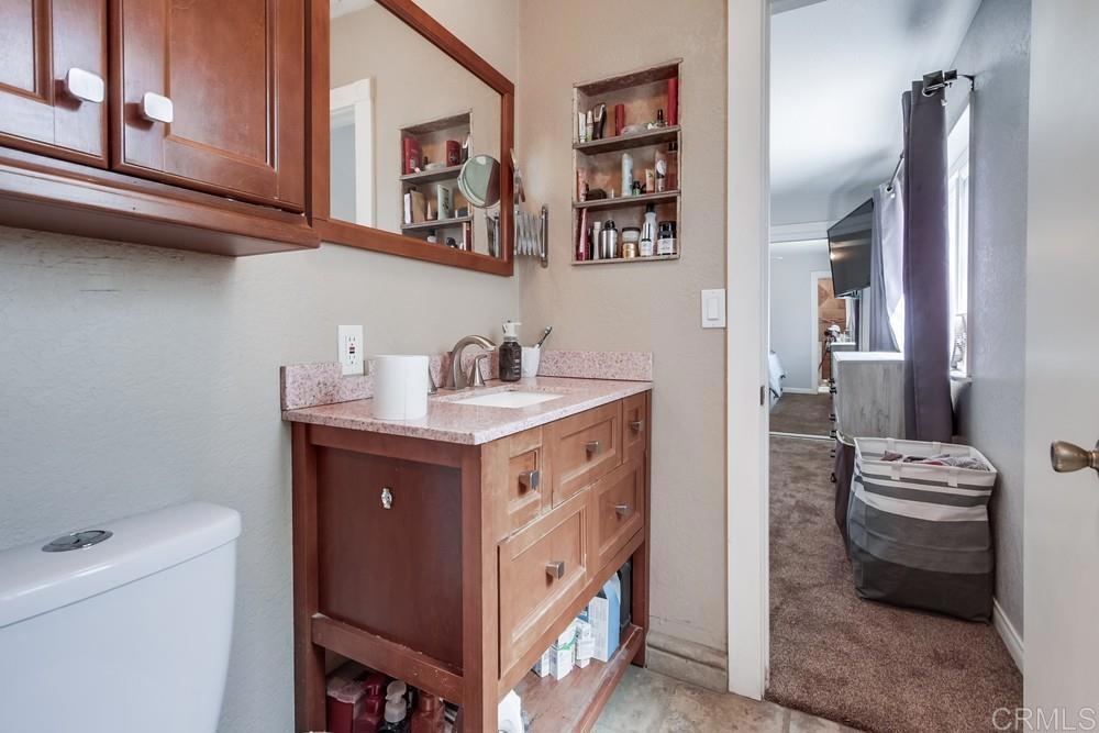 415 3rd Street Ramona, CA 92065 - Photo 18 of 33 a kitchen with a cabinets and a stove