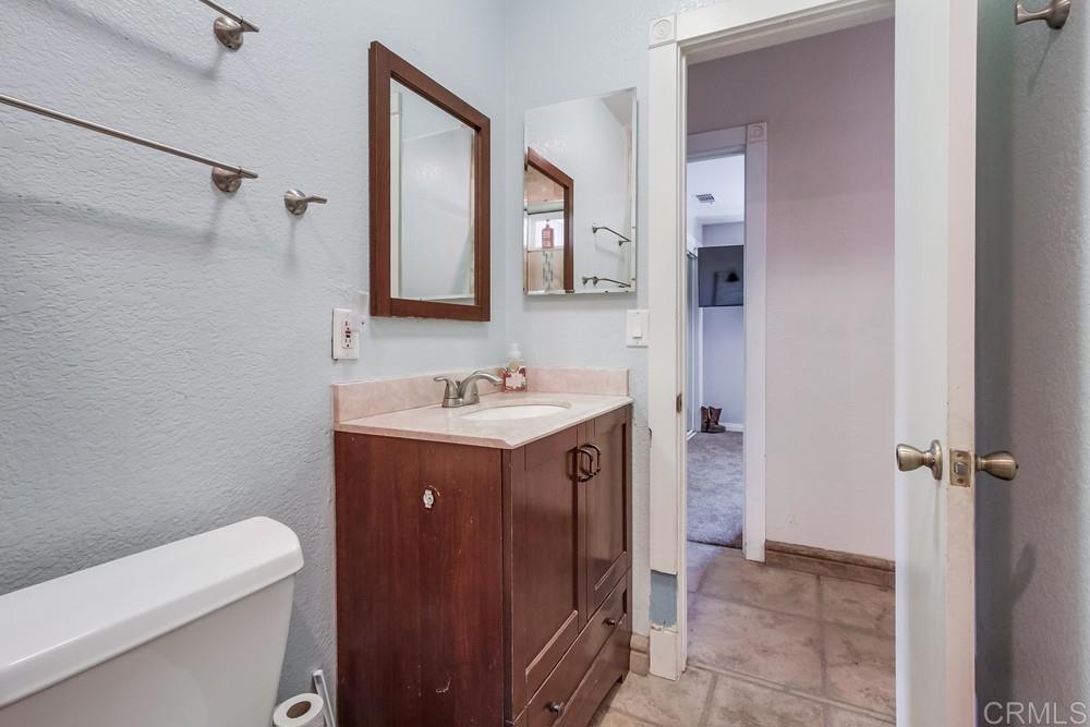 415 3rd Street Ramona, CA 92065 - Photo 24 of 33 a spacious bathroom with a sink vanity mirror and toilet