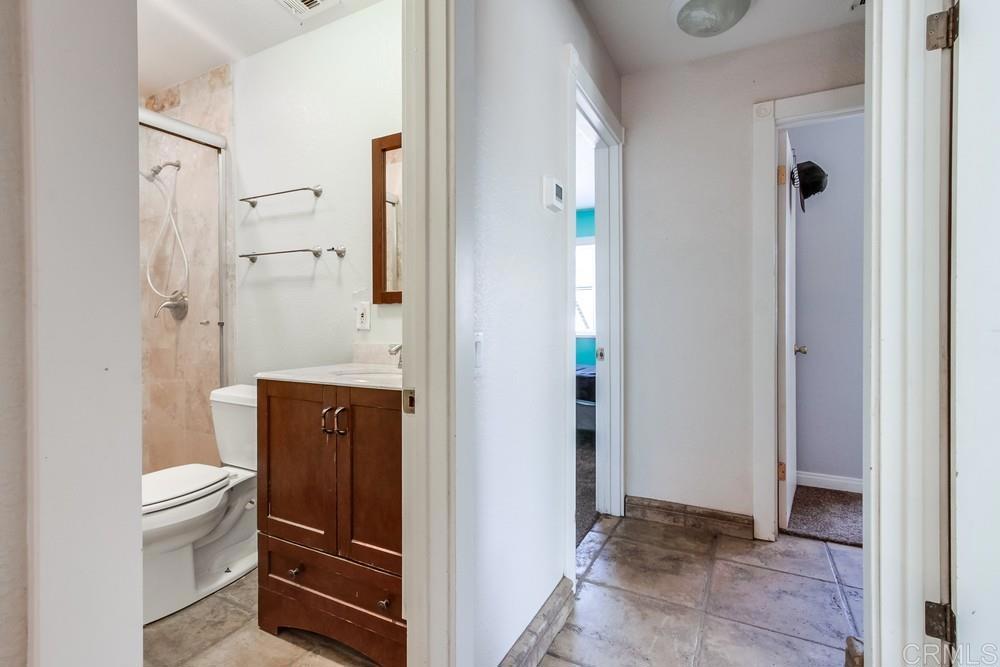 415 3rd Street Ramona, CA 92065 - Photo 25 of 33 a bathroom with a toilet and a shower