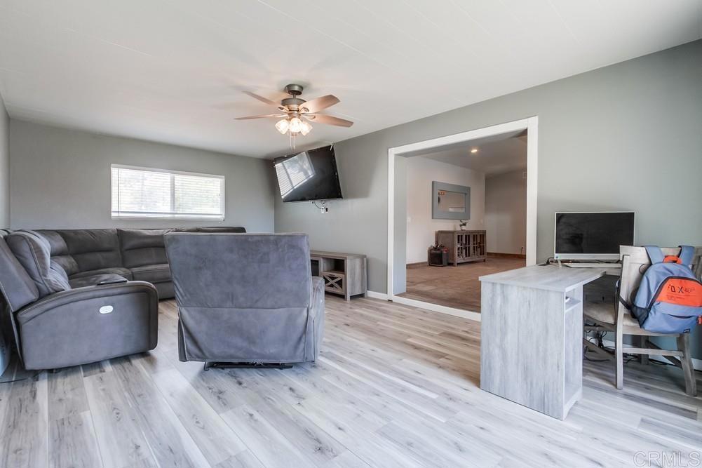 415 3rd Street Ramona, CA 92065 - Photo 6 of 33 a living room with furniture and a flat screen tv