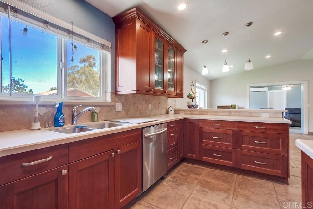 415 3rd Street Ramona, CA 92065 - Photo 8 of 33 a spacious bathroom with a granite countertop double vanity sink and a window