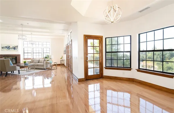 a view of a balcony with wooden floor and fence