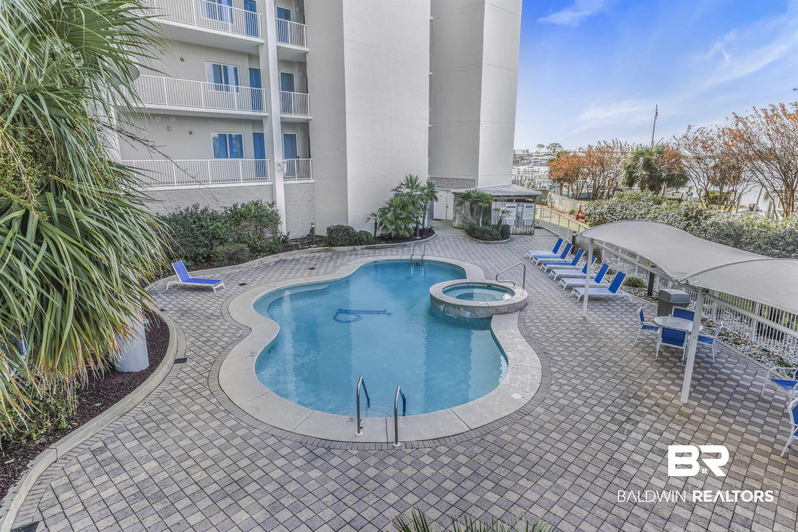 28250 Canal Road, Unit 106 Orange Beach, AL 36561 - Photo 35 of 50 View of pool with a patio area and a pool with connected hot tub