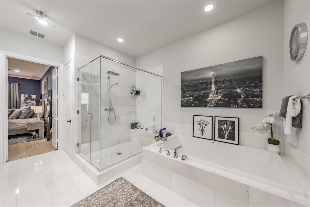 7333 Valley View Lane, Unit 902 Dallas, TX 75240 - Photo 23 of 40 a en suite spacious bathroom with a tub shower and mirror