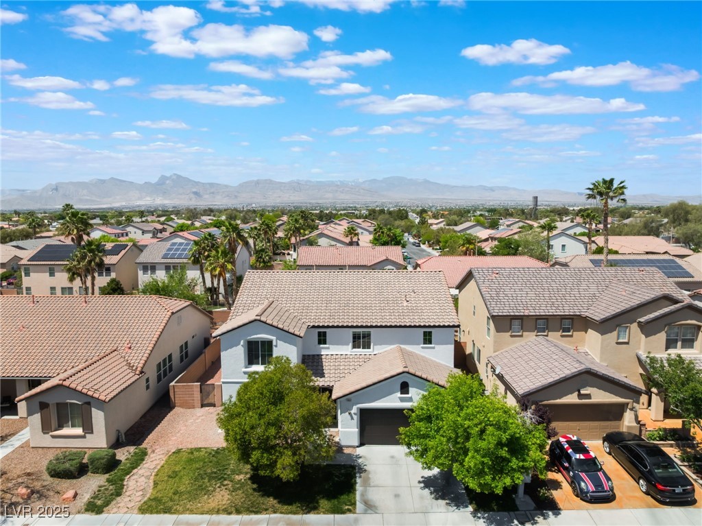 7857 Midnight Ride Street Las Vegas, NV 89131 - Photo 49 of 53 Aerial view of residential area with a mountainous background