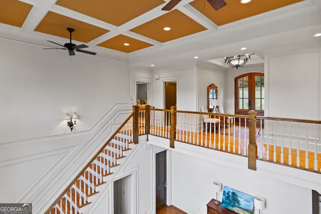 wooden floor with windows and stairs