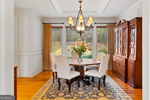a view of a dining room with furniture and window