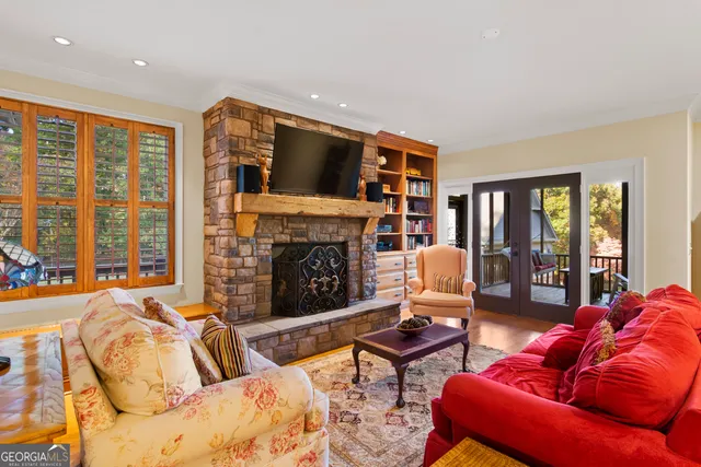 a living room with furniture fireplace and flat screen tv