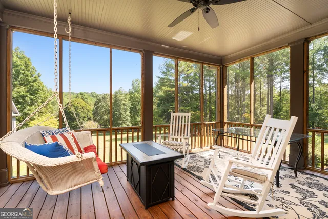 a view of a two chairs and table in the patio