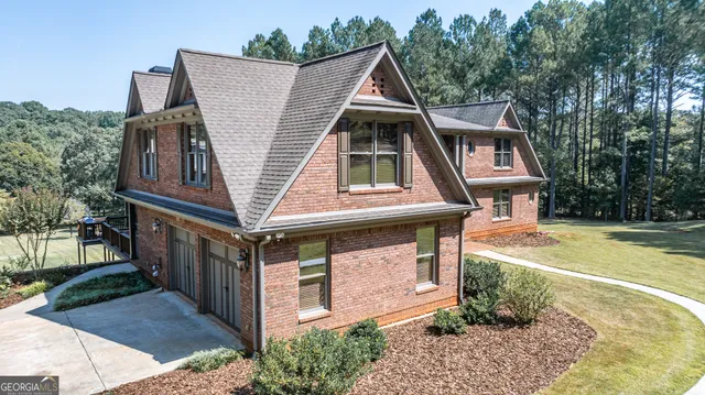 a aerial view of a house with a yard