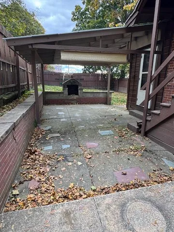 a view of room with wooden floor