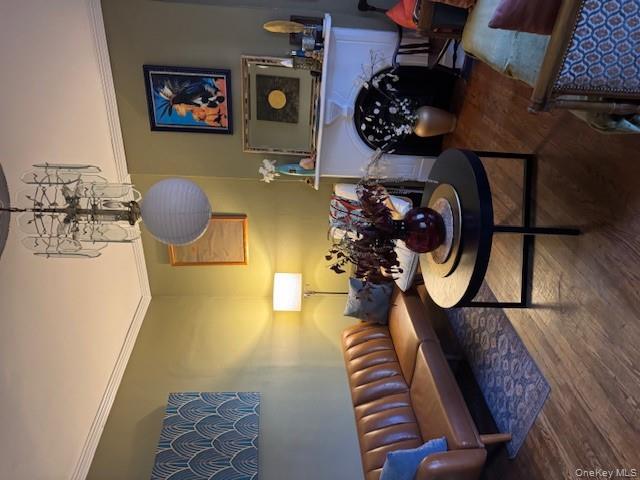 206 Mill Street, Unit 1 Poughkeepsie, NY 12601 - Photo 2 of 11 a living room with furniture a chandelier and a rug