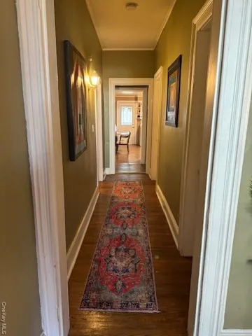 a view of gallery with wooden floor