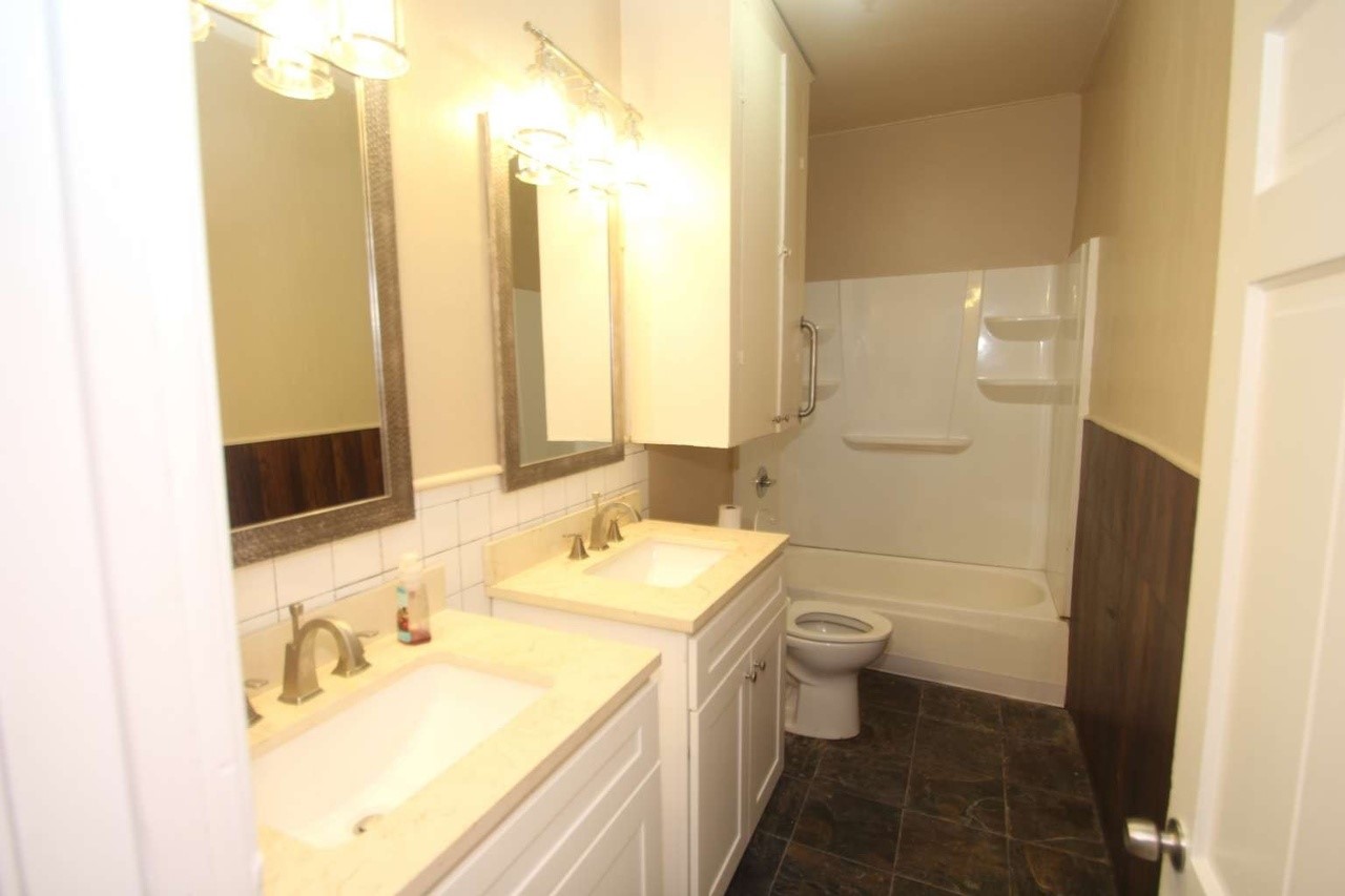 422 Tennessee Street Houston, TX 77029 - Photo 8 of 8 a bathroom with a sink and a mirror