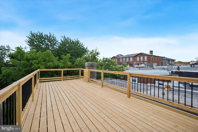 a view of balcony with deck and wooden floor