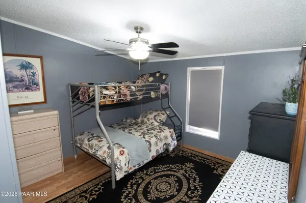 a bed room with a bed and a dresser