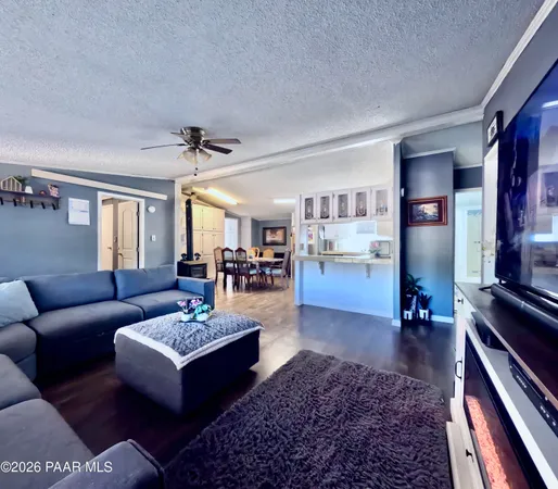 a living room with furniture rug and window