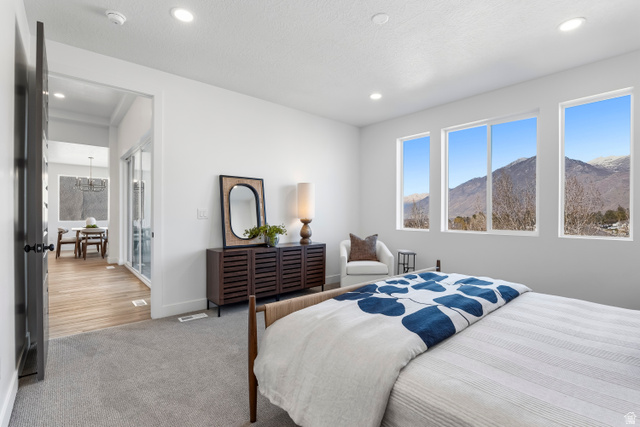 624 North Legend Circle, Unit 480 Mapleton, UT 84664 - Photo 24 of 34 Bedroom featuring a mountain view, carpet floors, and hanging lights