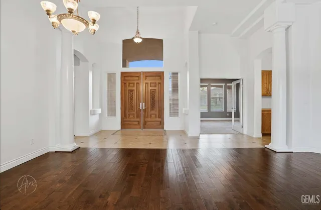 a view of an entryway with wooden floor