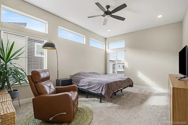 a bedroom with furniture and a window