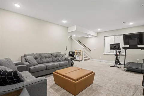 a living room with furniture and white walls