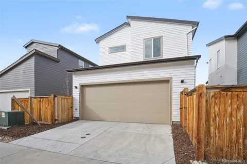 a front view of a house with garage