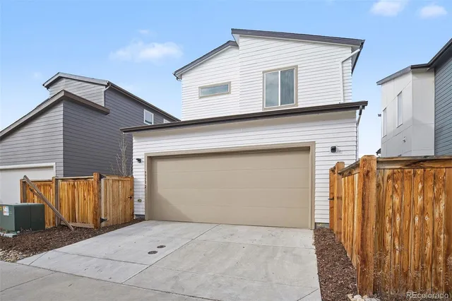 a front view of a house with garage