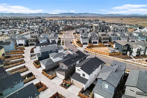 an aerial view of a city with ocean view
