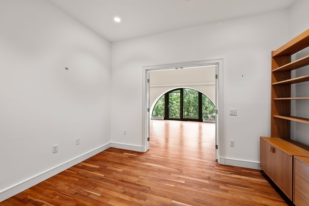 2420 Beacon Street, Unit 402 Boston, MA 02467 - Photo 19 of 29 a view of empty room with wooden floor and fan
