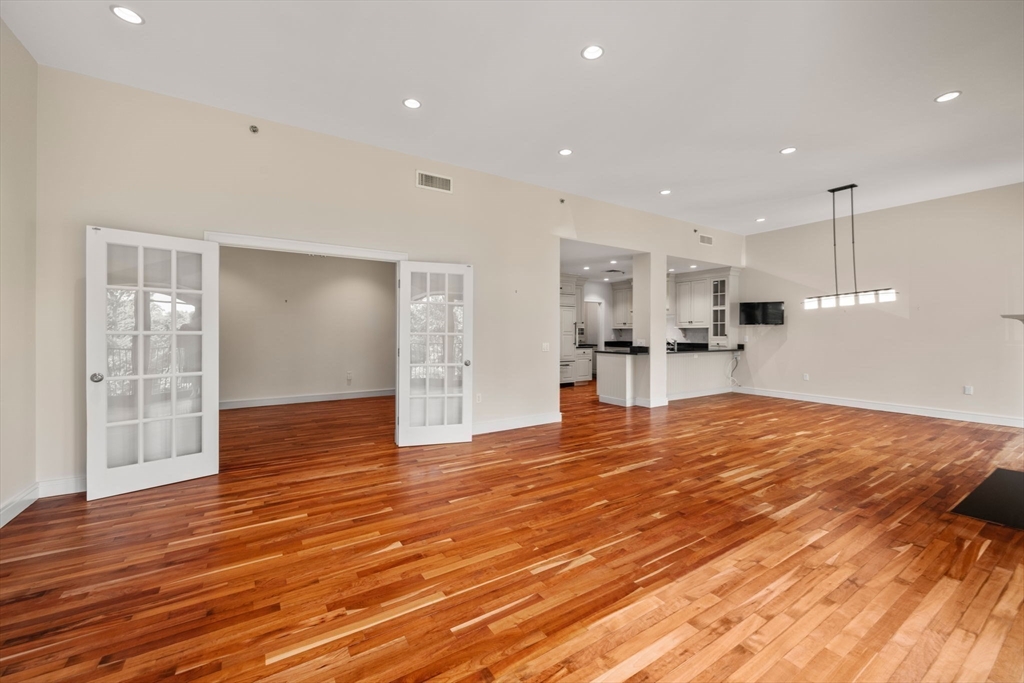 2420 Beacon Street, Unit 402 Boston, MA 02467 - Photo 21 of 29 a view of empty room with wooden floor