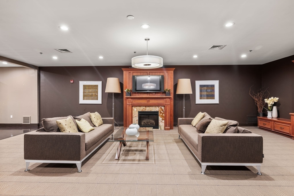 2420 Beacon Street, Unit 402 Boston, MA 02467 - Photo 26 of 29 a living room with furniture fireplace and couch