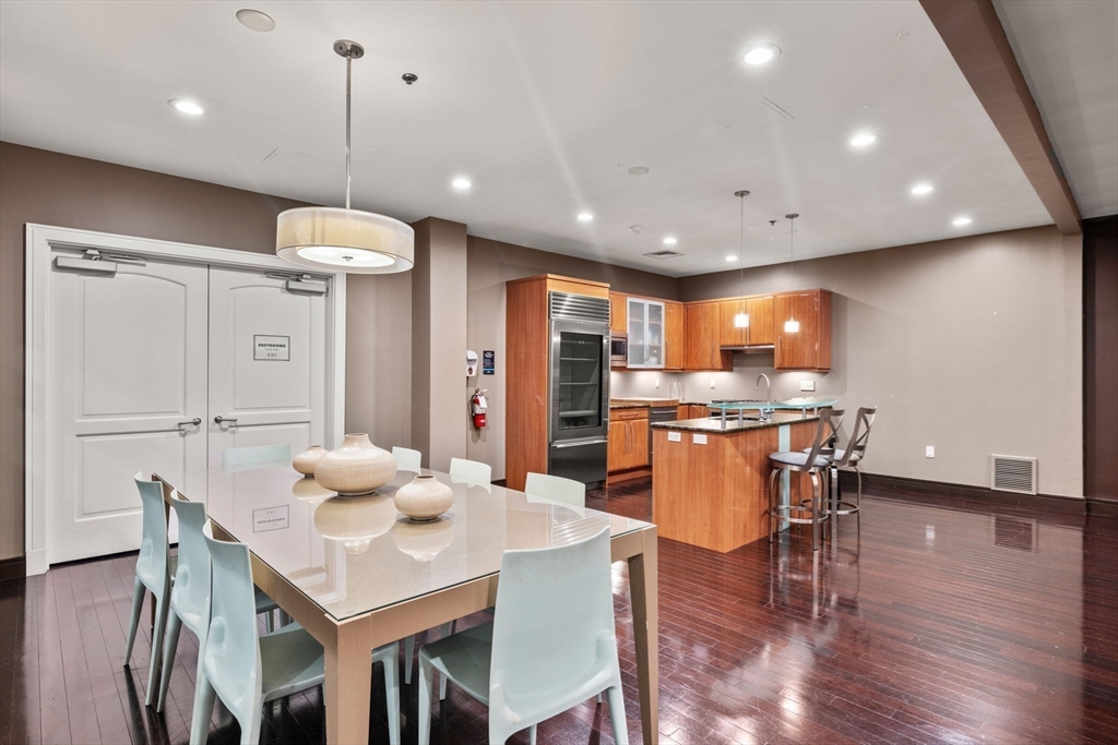 2420 Beacon Street, Unit 402 Boston, MA 02467 - Photo 27 of 29 a kitchen with a table and chairs