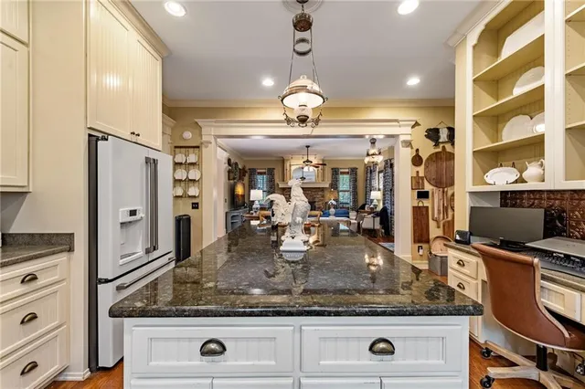 a kitchen with stainless steel appliances granite countertop a sink and cabinets