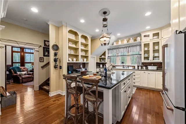 a living room with furniture fireplace and window