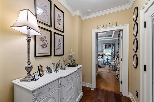a bedroom with a bed dresser and a large window