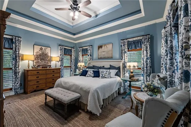 a spacious bathroom with a double vanity sink large mirror and bathtub