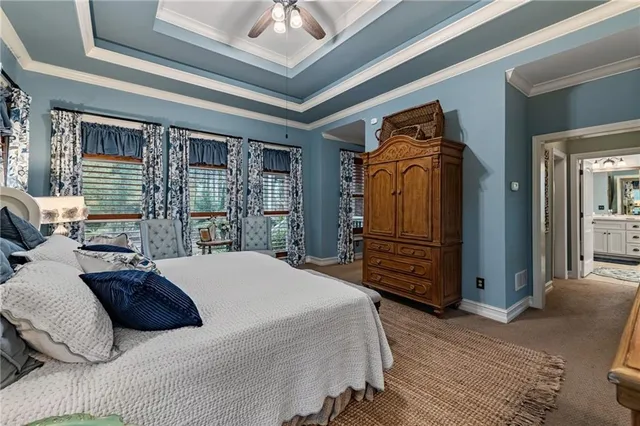 a spacious bathroom with a granite countertop tub mirror and shower