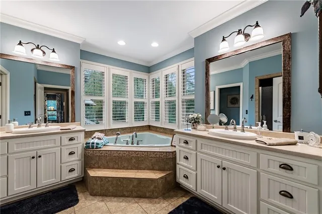 a bathroom with a toilet a sink and a mirror